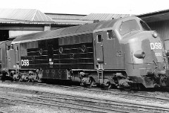 DSB MX 1030 photographed at the railwaystation in Fredericia 5. May 1978.  The MX class was built by Nydquist & Holm AB (NOHAB) in Sweden licensed by General Motors. It was based on the MY class, but was bult with a lower axle load for the Danish branch lines. The MX class was put in service in 1960 - 1962. A1A-A1A. Dieselelectric. 1.445 hp. Max speed 133 km/h - 83 mph. Length 18 300 mm. Weight 89 metric tonnes. Built in a number of 45. MX 1030 was put in service in 1961. Withdrawn from service in 1989. Scrapped in 1991. Sold 1995 to TTVJ (Tønder-Tinglev). Sold 1999 to PBS. Sold 2002 to Michael Frick.